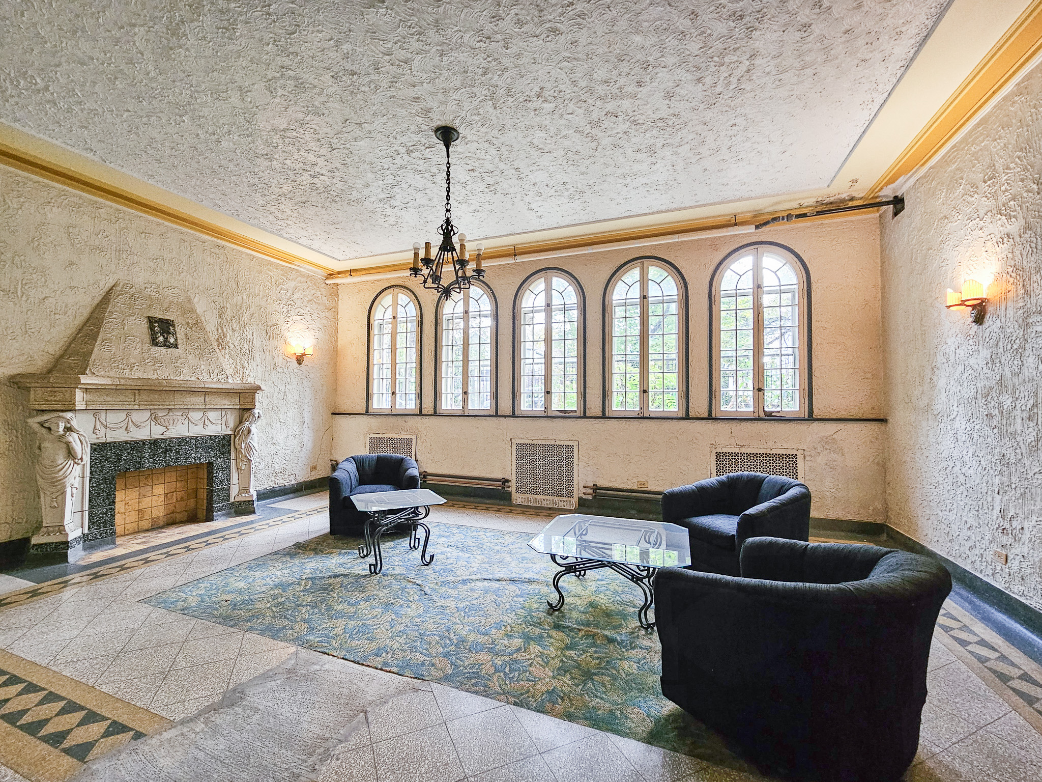 Grand Restored Pre-War Lobby with Carved Stone Fireplace Managed by Hunter Properties