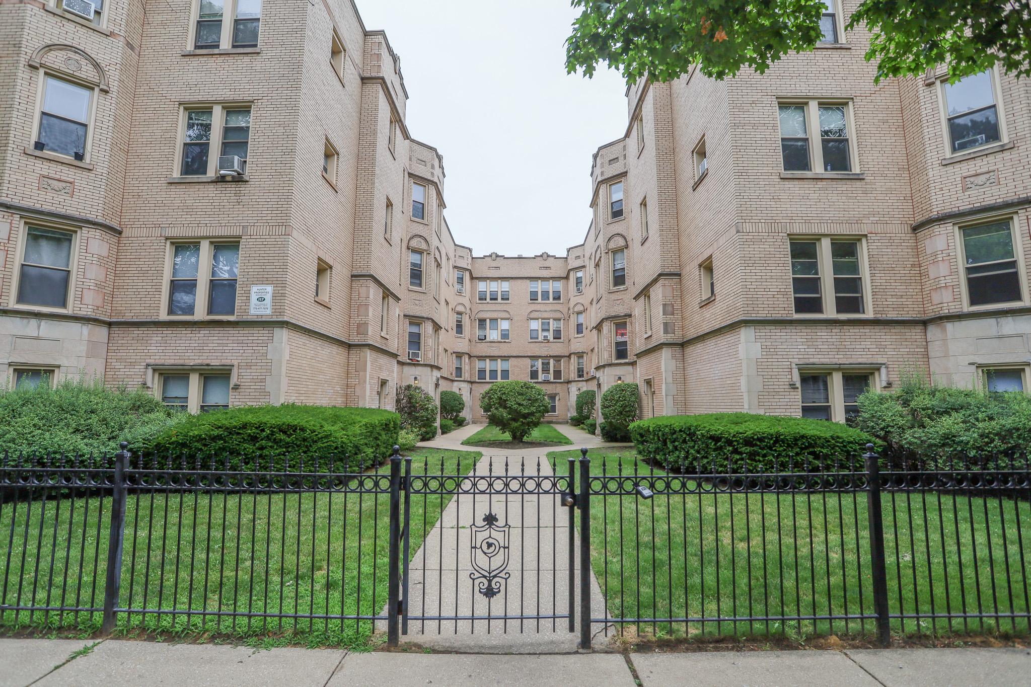 Classic Chicago Courtyard Multifamily Complex with Hunter Properties Plaque